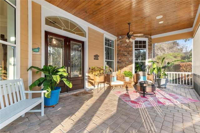 view of patio / terrace featuring a porch and a ceiling fan