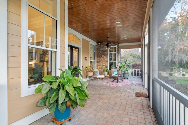 unfurnished sunroom with wooden ceiling and french doors