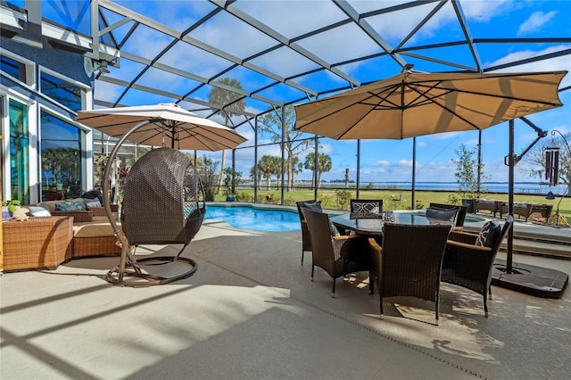 view of swimming pool with an outdoor living space, a patio, and a lanai