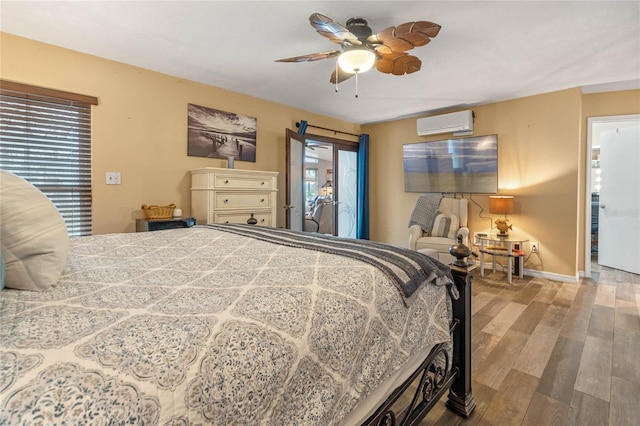 bedroom with multiple windows, light hardwood / wood-style flooring, an AC wall unit, and access to outside