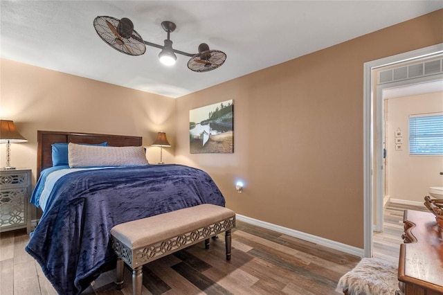 bedroom with hardwood / wood-style flooring and ceiling fan