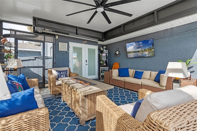 living room with french doors and ceiling fan