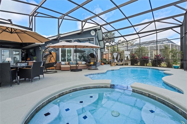 view of swimming pool featuring a lanai, an outdoor hangout area, an in ground hot tub, and a patio area