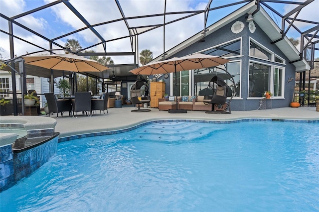 view of swimming pool with outdoor lounge area, a patio, glass enclosure, and an in ground hot tub