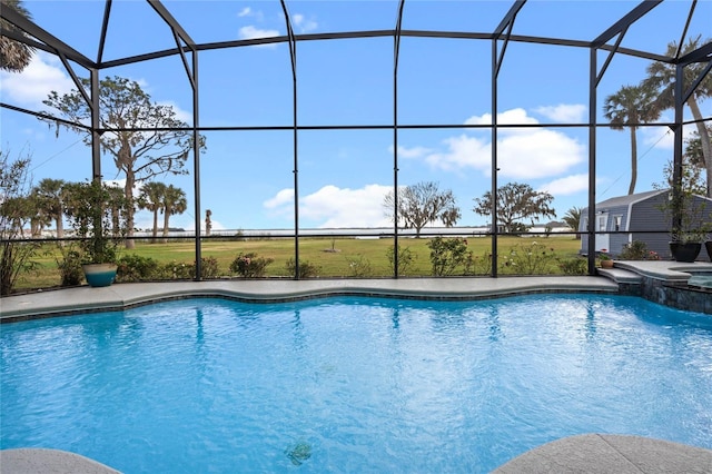 view of swimming pool featuring a lanai