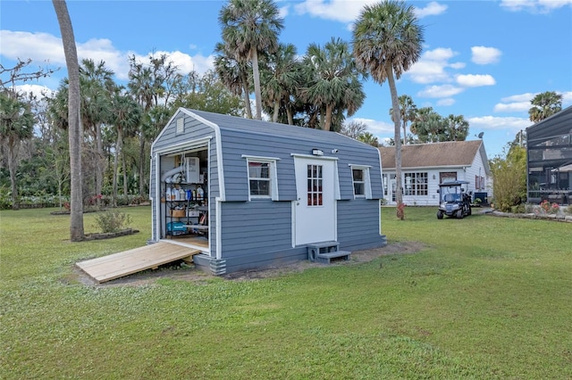 view of outbuilding with a lawn