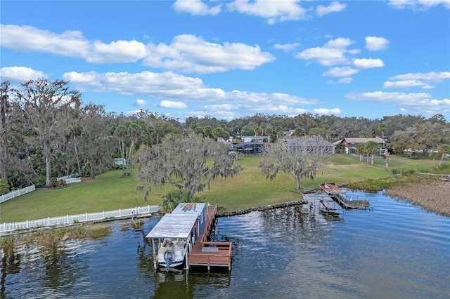 dock area featuring a yard and a water view