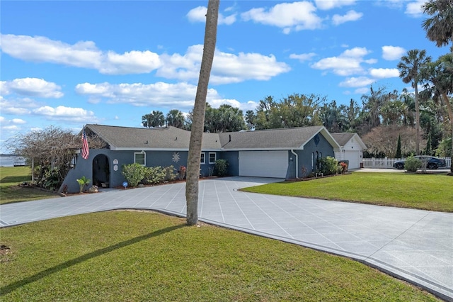 single story home with a garage and a front yard