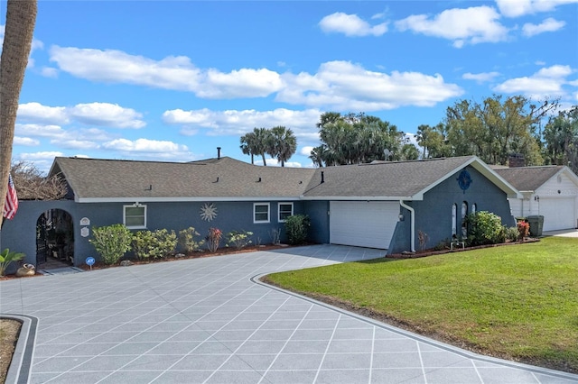 ranch-style home featuring a garage and a front yard