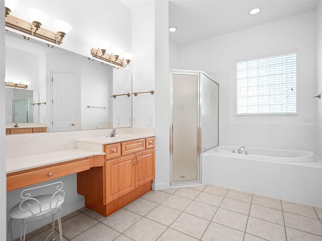 bathroom with a bath, a stall shower, and tile patterned floors