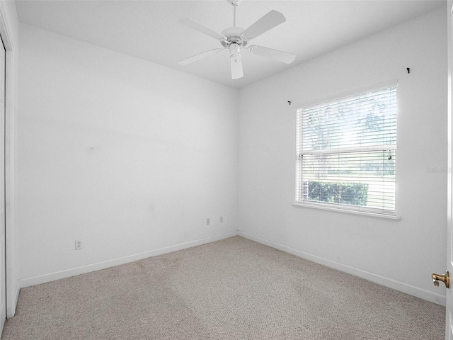 unfurnished room featuring ceiling fan, baseboards, and carpet floors