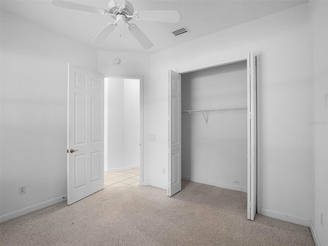 unfurnished bedroom with ceiling fan, a closet, visible vents, carpet flooring, and baseboards