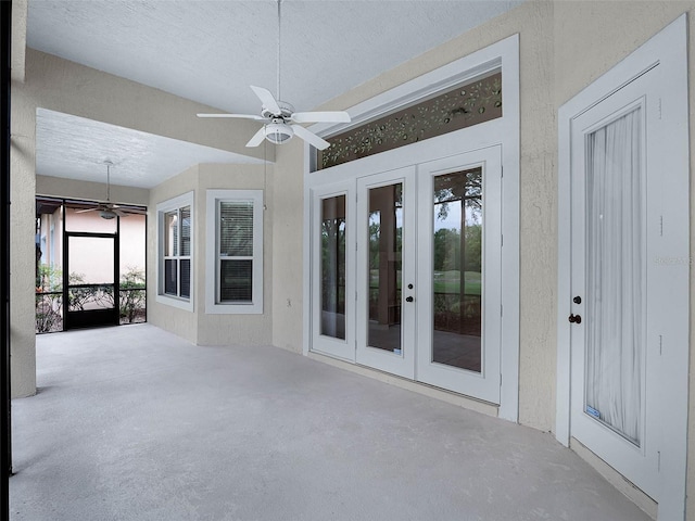 unfurnished sunroom featuring french doors