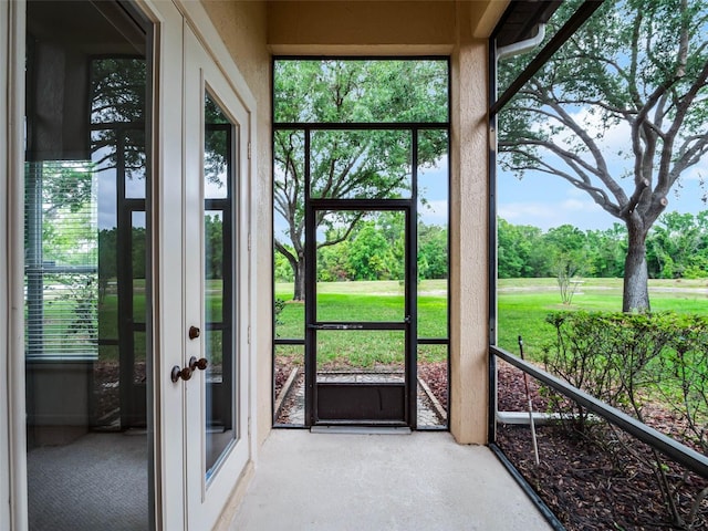 unfurnished sunroom featuring a wealth of natural light