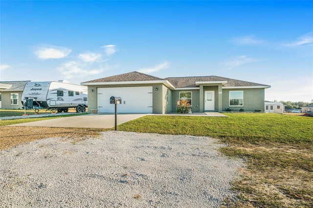 view of front facade with a garage and a front lawn