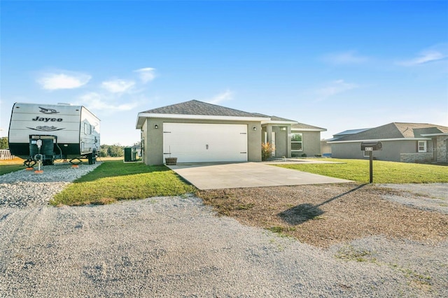 view of front of house featuring a garage and a front lawn