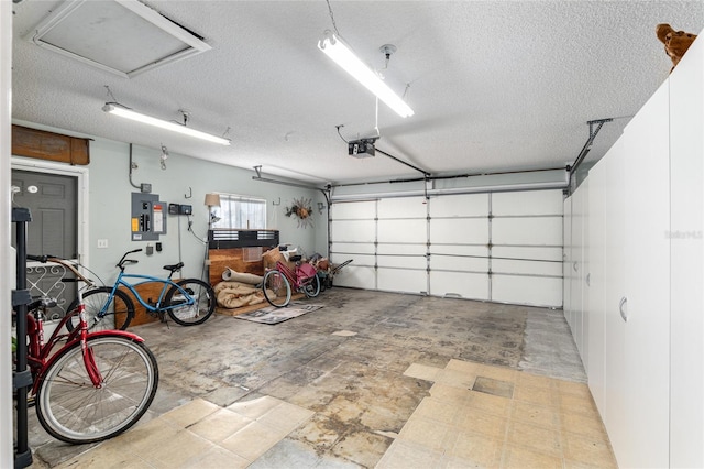 garage with electric panel and a garage door opener