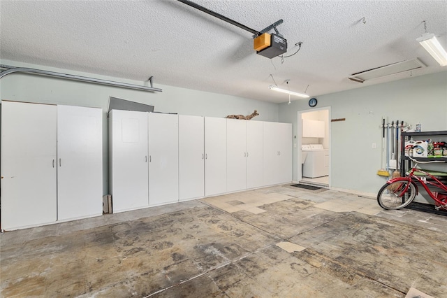 garage featuring washer / clothes dryer and a garage door opener