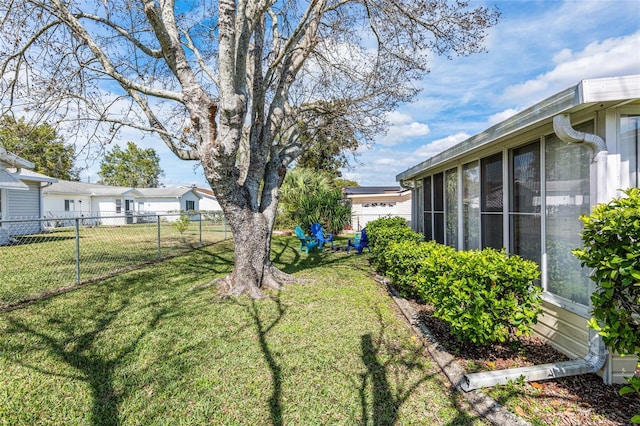 view of yard with a sunroom