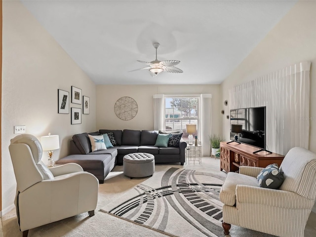 carpeted living room with ceiling fan and lofted ceiling