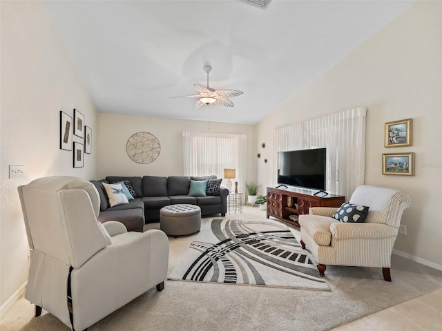 living room with vaulted ceiling, light tile patterned floors, and ceiling fan