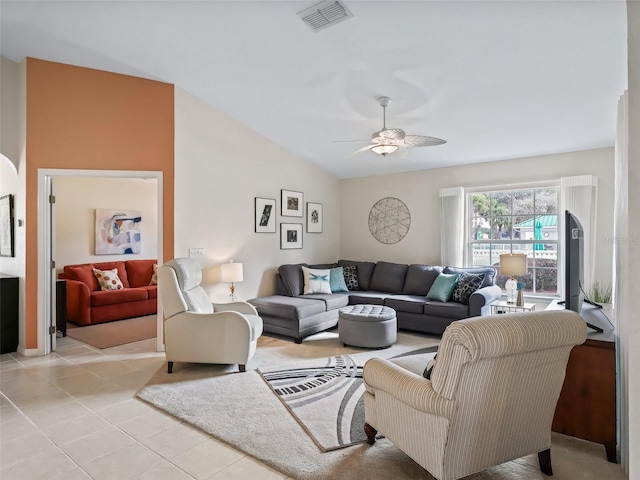 tiled living room featuring lofted ceiling and ceiling fan