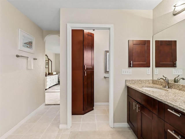 bathroom featuring tile patterned floors and vanity