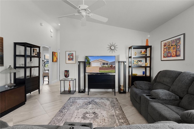 tiled living room featuring ceiling fan and high vaulted ceiling