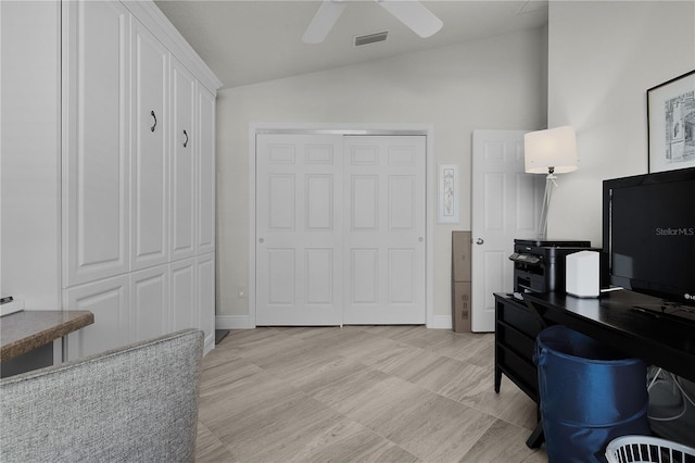 office with vaulted ceiling and ceiling fan