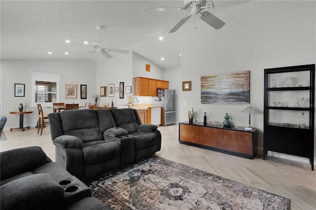 living room featuring high vaulted ceiling, sink, and ceiling fan