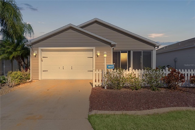 single story home featuring a garage