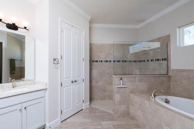 bathroom featuring vanity, ornamental molding, and separate shower and tub