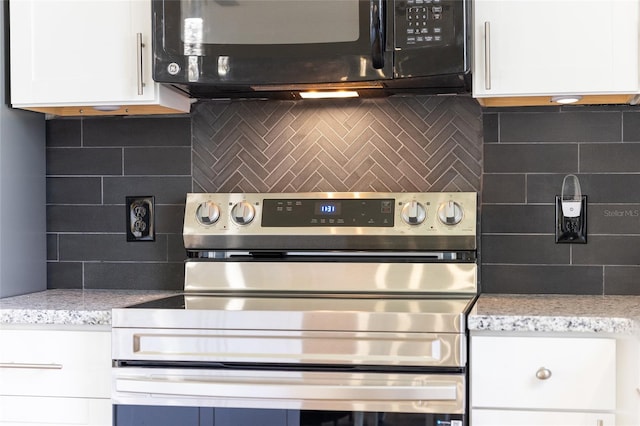 kitchen featuring white cabinets, light stone countertops, electric range, and decorative backsplash