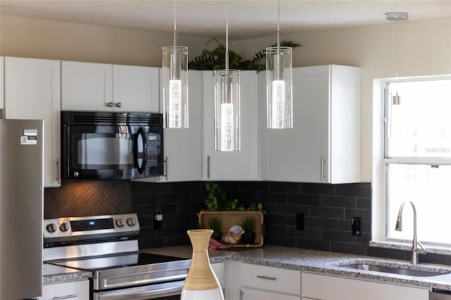 kitchen featuring stainless steel appliances, white cabinetry, sink, and tasteful backsplash