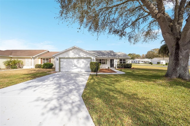 ranch-style house with a garage and a front yard