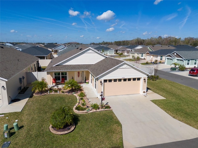 view of front of house with a garage and a front lawn