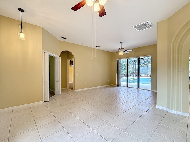 unfurnished room featuring light tile patterned floors and ceiling fan