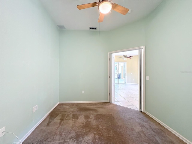 carpeted empty room with ceiling fan