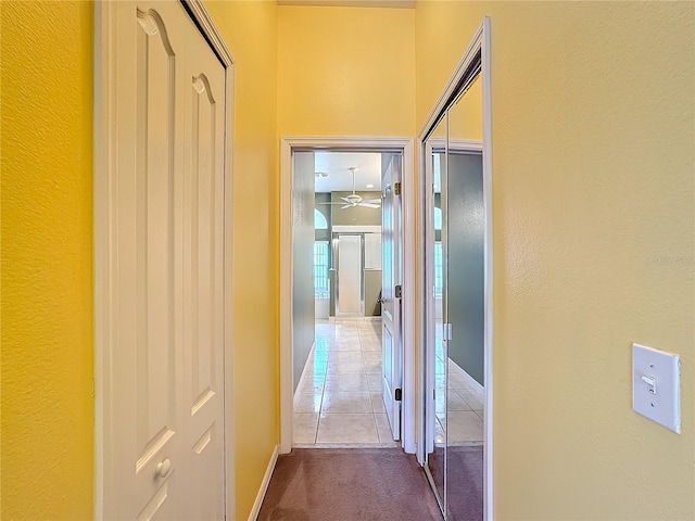 corridor featuring tile patterned flooring