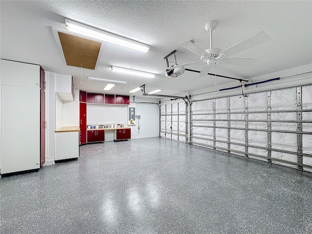 garage featuring a garage door opener and ceiling fan