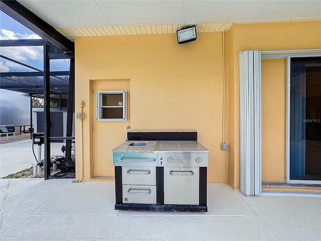 view of patio / terrace featuring a lanai