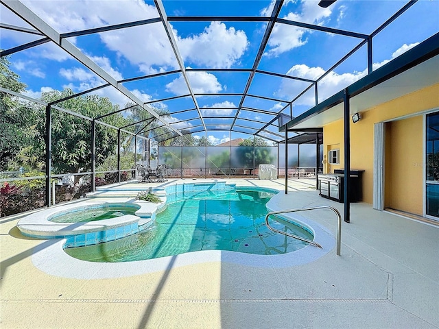 view of pool featuring an in ground hot tub, a lanai, and a patio