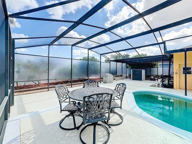 view of swimming pool with a lanai and a patio