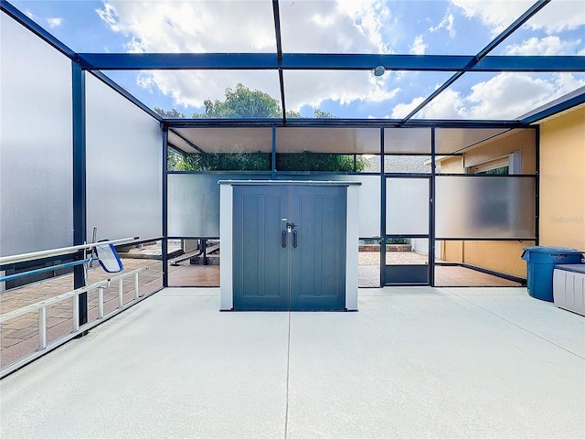 view of patio / terrace featuring a storage shed