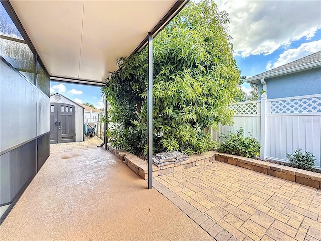 view of patio with a storage unit