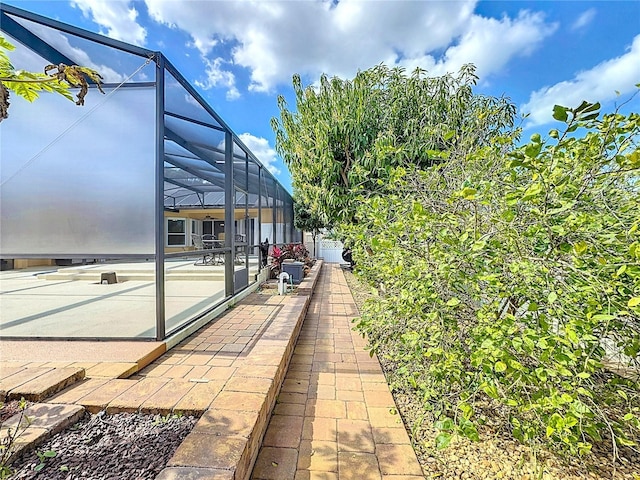 view of patio with a lanai