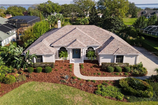 view of front of property with a lanai and a front lawn