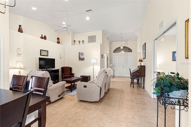 living area featuring light tile patterned floors, ceiling fan, and visible vents