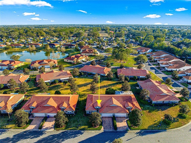 bird's eye view featuring a water view and a residential view