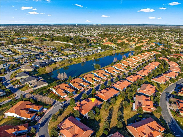 drone / aerial view with a water view and a residential view